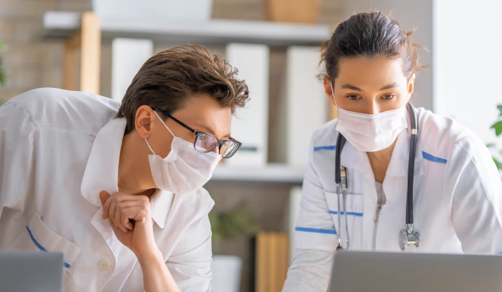Two doctors discussing the progression of a case of IgA nephropathy Two doctors discussing the progression of a case of IgA nephropathy