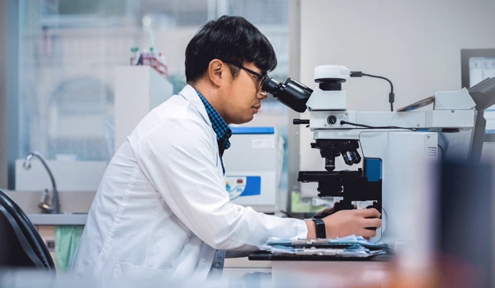 The treatment gap Researcher works with microscope to develop new treatments for IgA nephritis